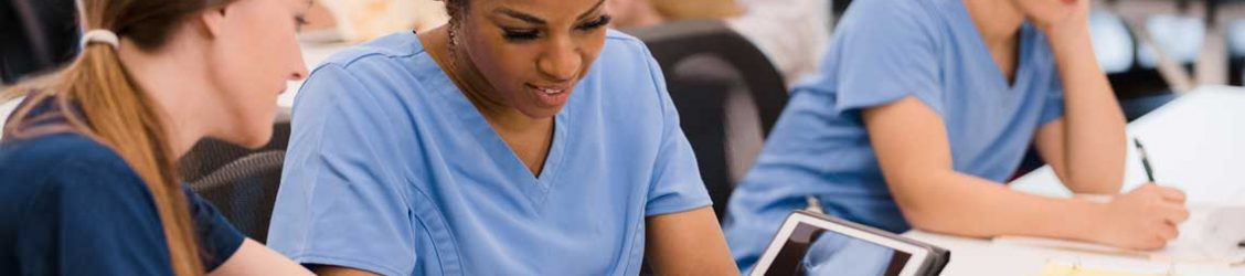 nursing students looking at tablet
