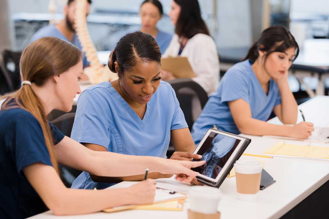 nursing students looking at tablet