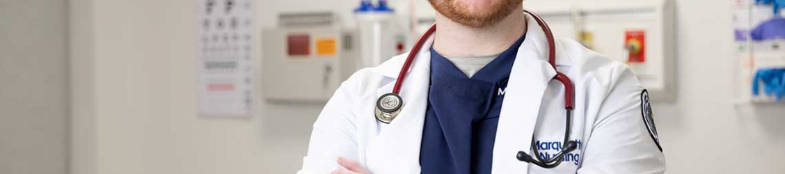Marquette MSN student wearing lab coat in lab