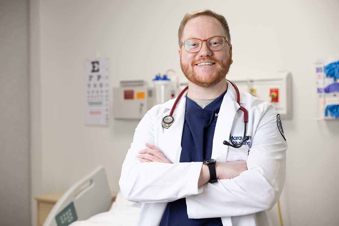 Marquette MSN student wearing lab coat in lab
