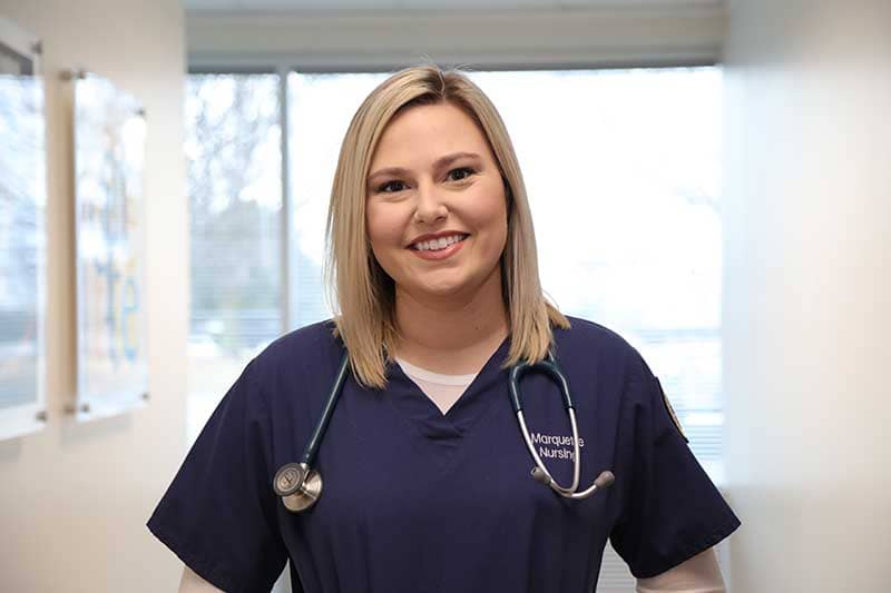 Marquette MSN student in scrubs
